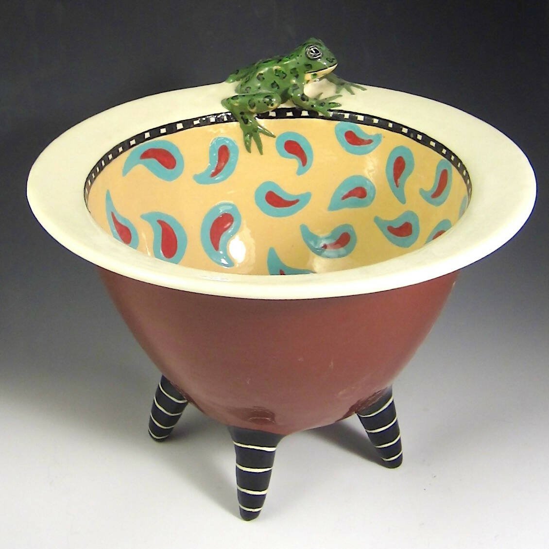 Paisley Frog on striped legged bowl